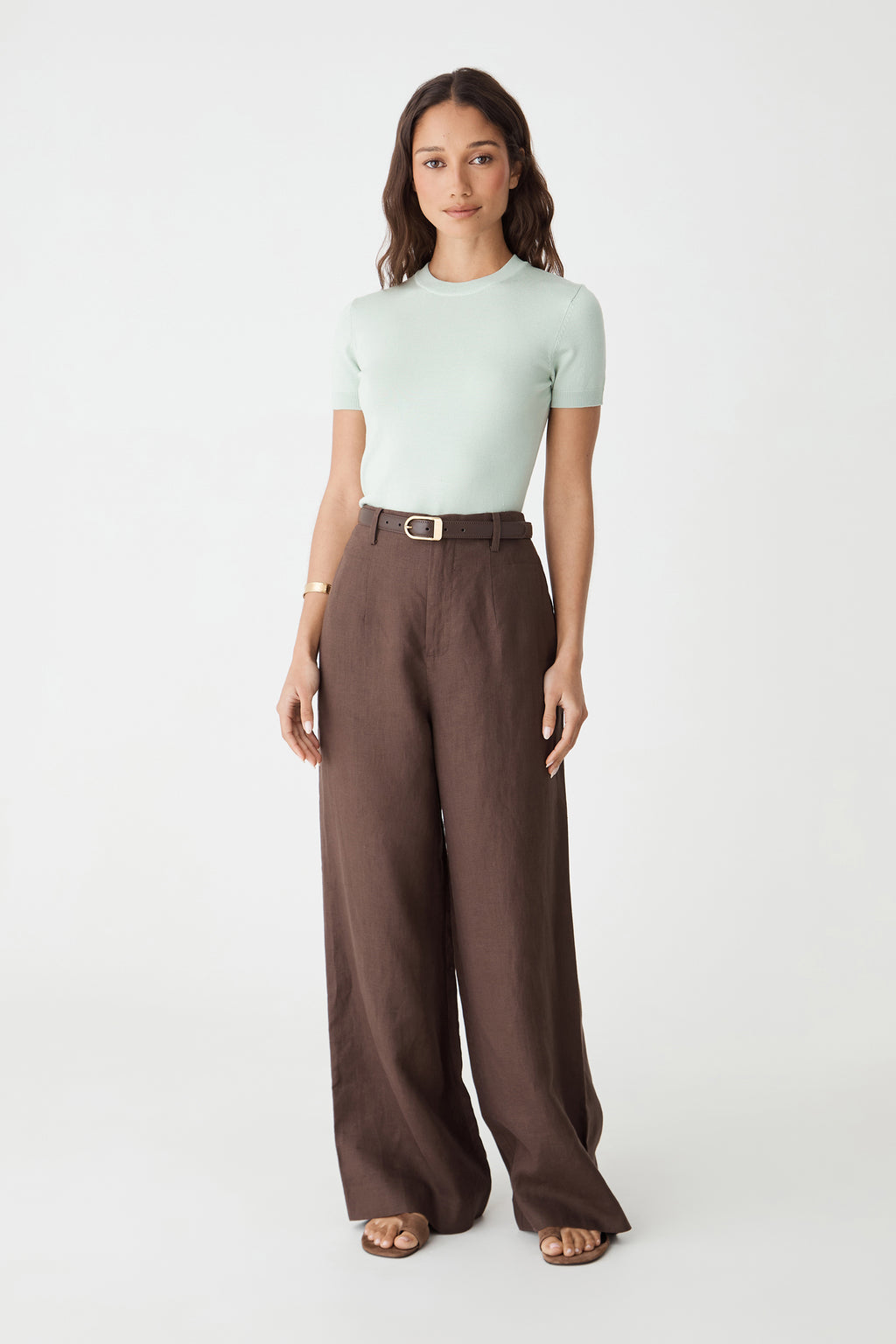 Catherine Short Sleeve Knit in jade, front view worn with brown wide-leg trousers