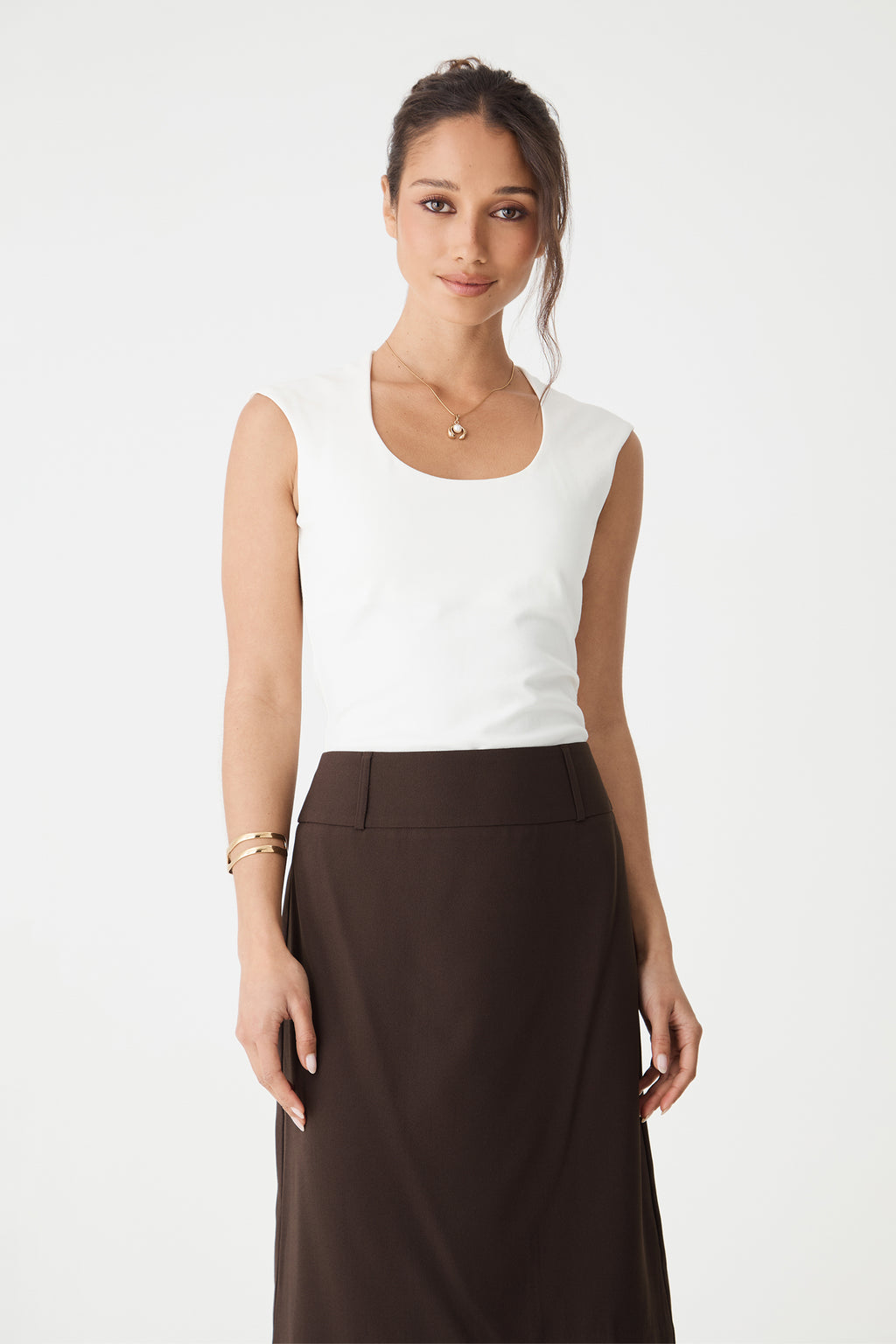 Close-up front view of the rounded square neckline and cap sleeves