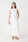 Kenya Linen Skirt in ivory, front view worn with matching sleeveless ivory top and tan sandals