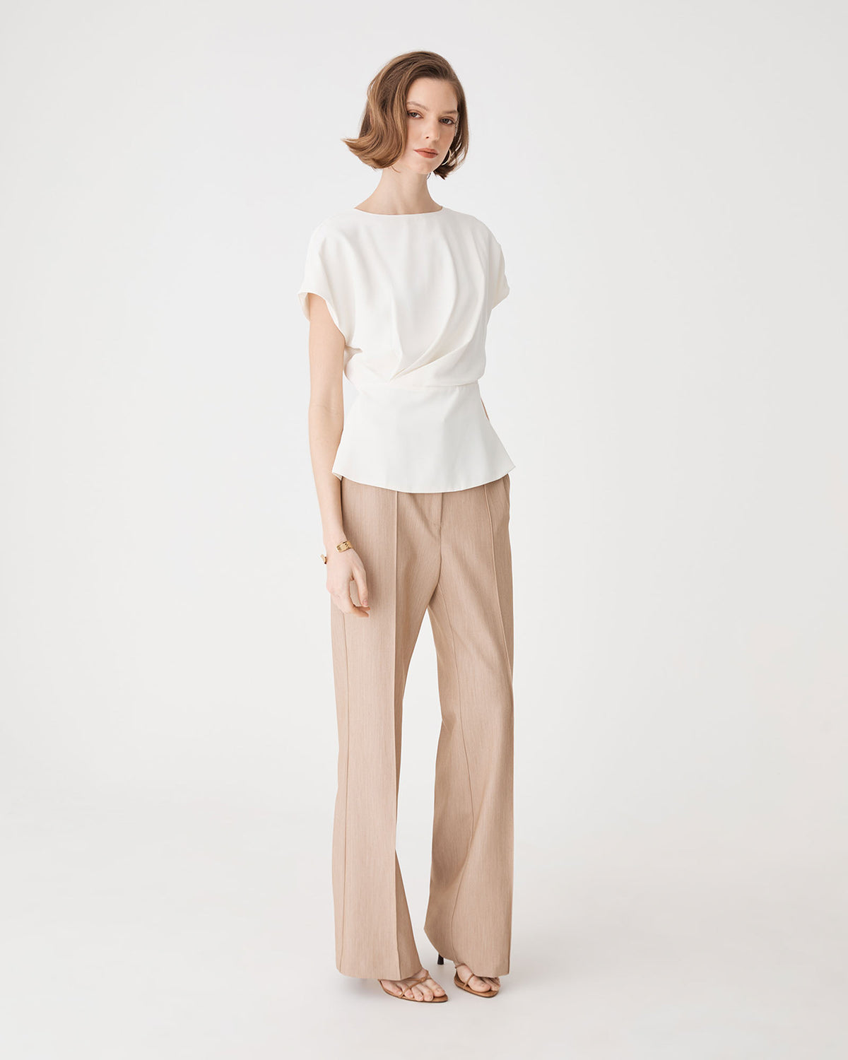 Bonnie Gathered Peplum Top in ivory — side view