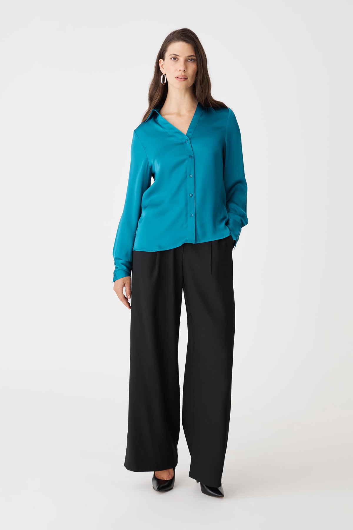 Lila V-Neck Satin Blouse in aquamarine, front view worn with black wide-leg trousers