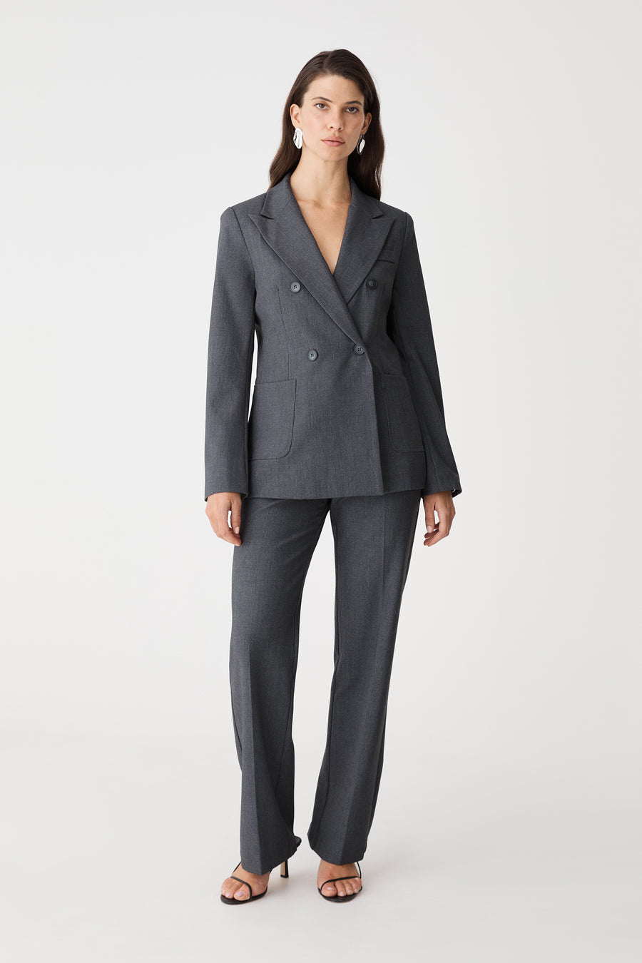 Merid Double Breasted Blazer in dark grey, front view worn with matching tailored pants