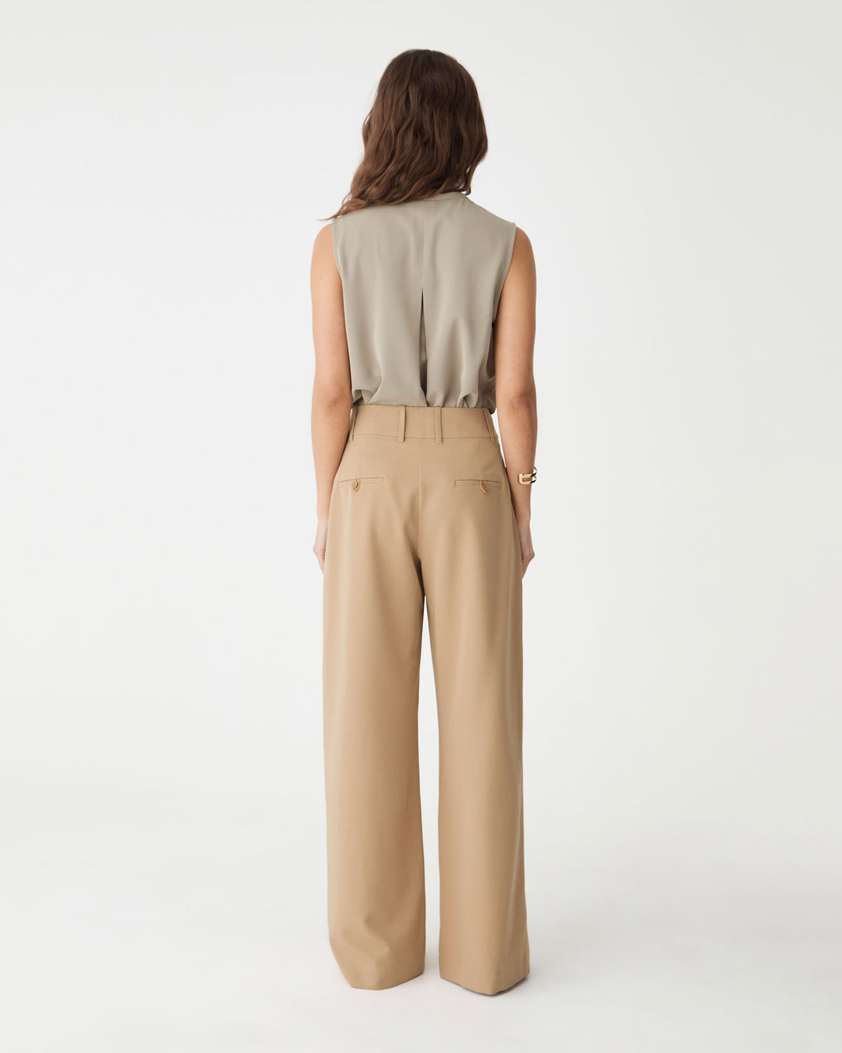 Back view of the camel wide-leg pants with faux welt pockets