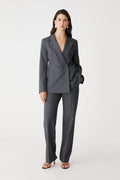 Merid Tailored Pants in dark grey, front view worn with matching double breasted blazer