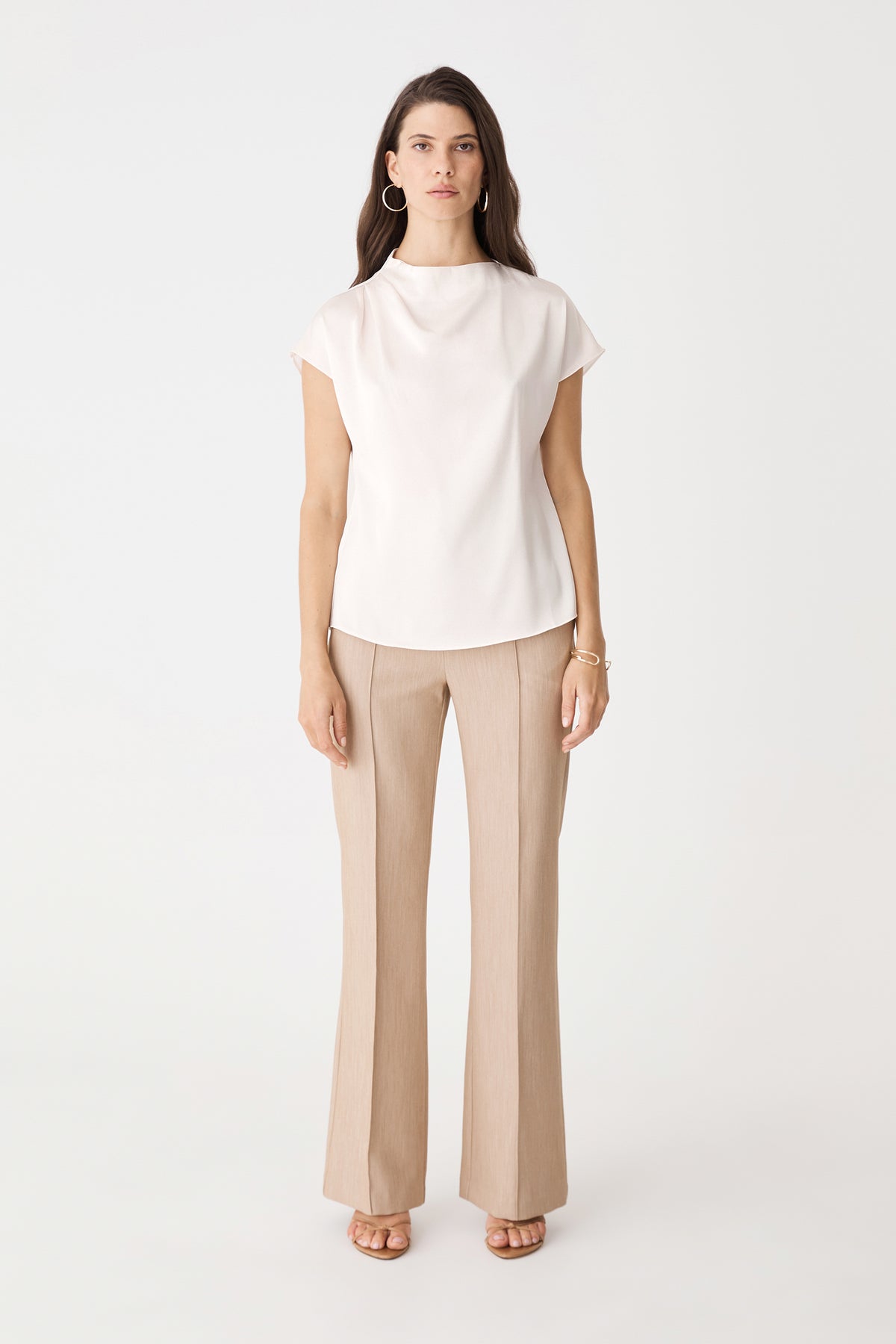 Zafina Pleated Draped Top in pearl, front view with cap sleeves, worn with beige trousers