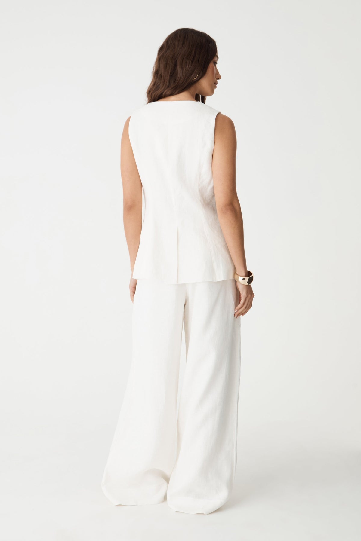 Back view of the white Ami V-Neck Linen Vest and matching wide leg pants