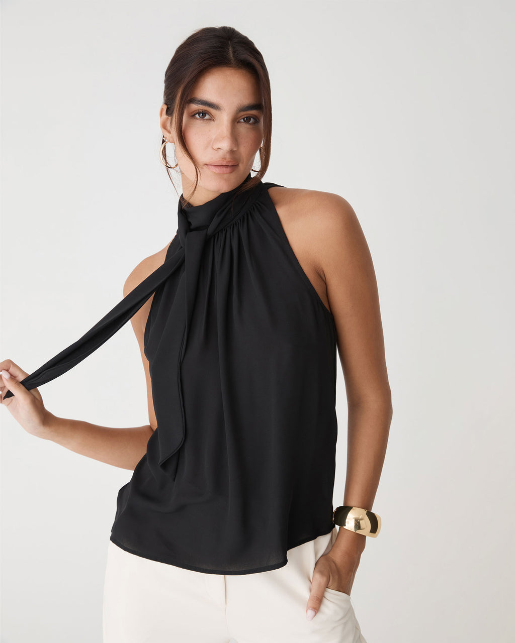 Shelby Draped Sleeveless Top in black — close-up view
