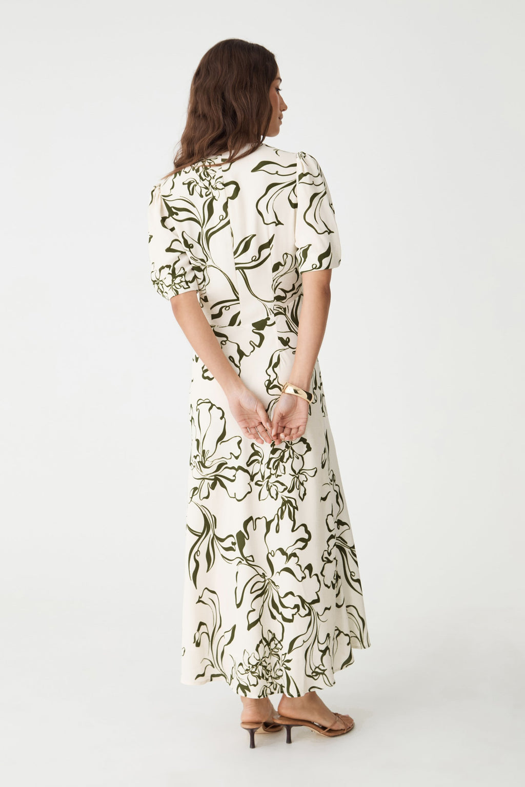 Back view showing concealed back zip and midi-length skirt