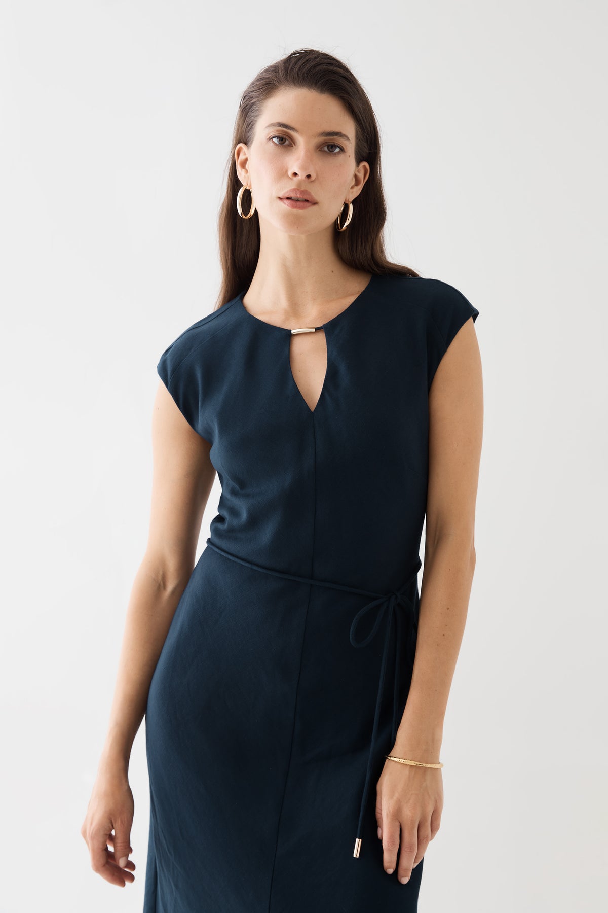 Close-up front view of the neckline and waist tie in navy