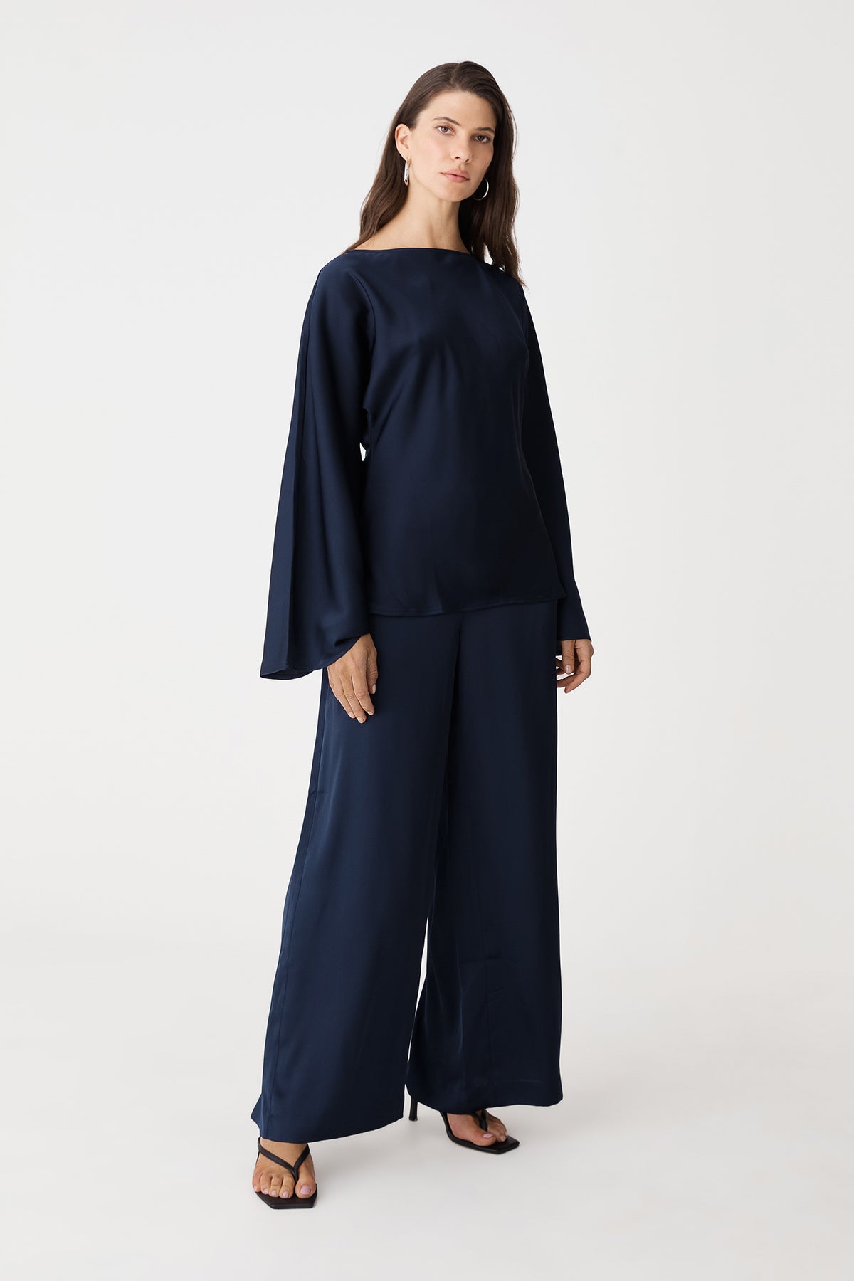 Front view of the navy satin wide-leg pants and matching top, full length to the floor
