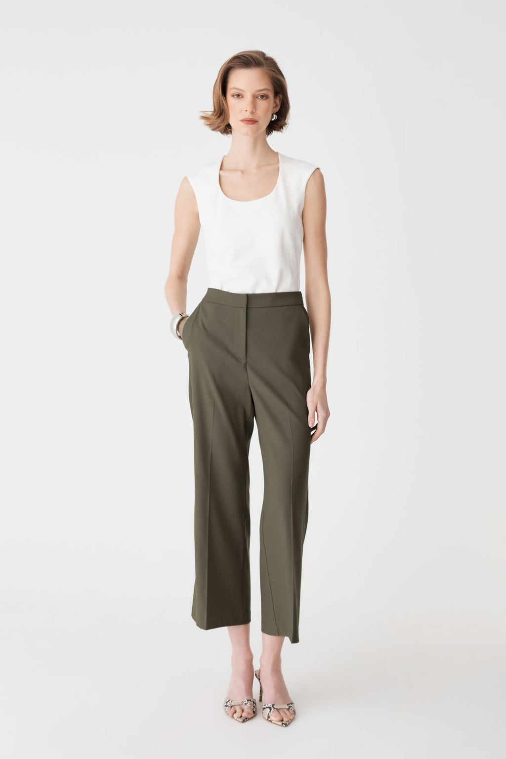Milan Crop Flare Pants in khaki, front view worn with a white sleeveless top
