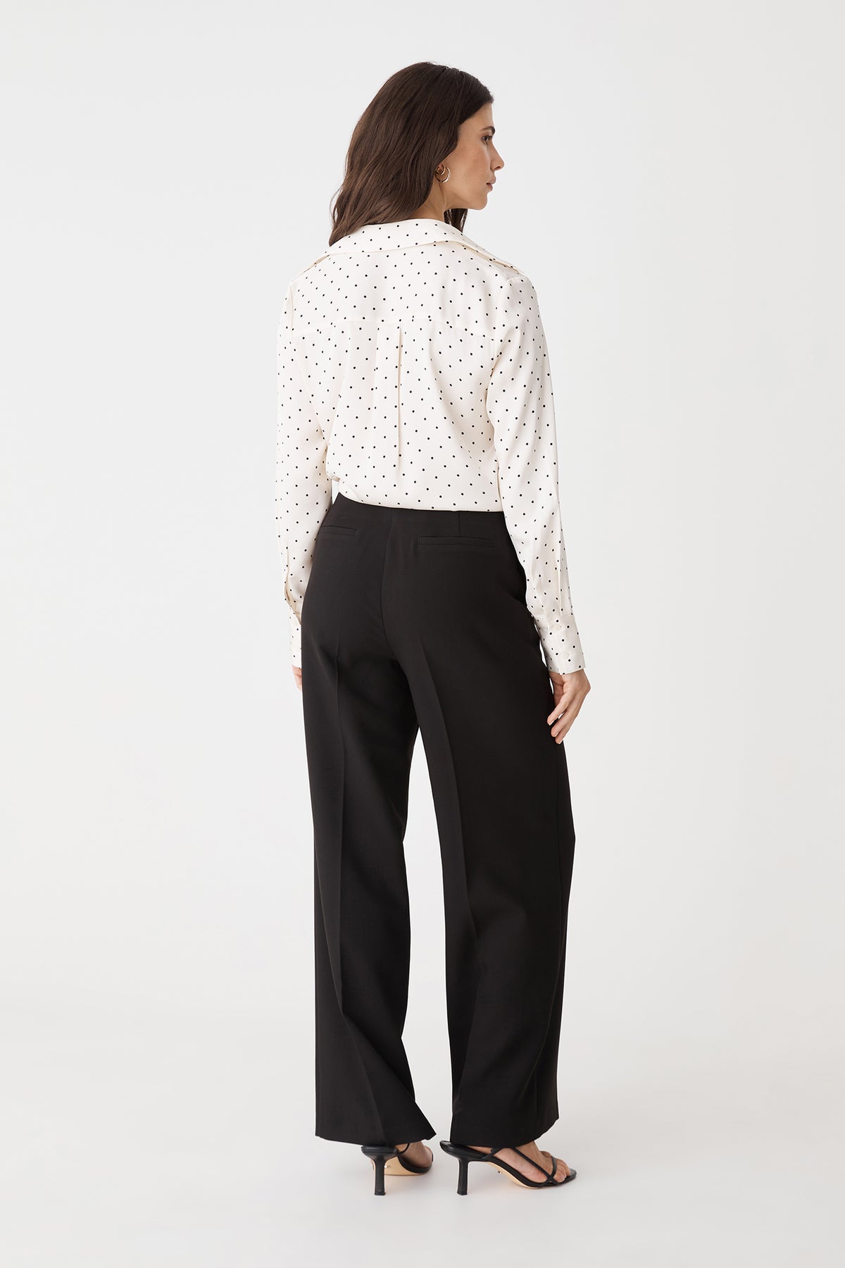 Back view of the black straight leg pants with back welt pockets