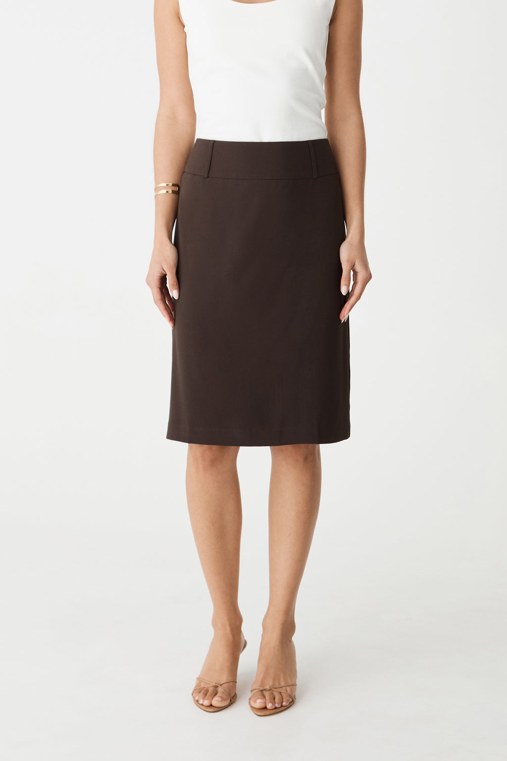 Front view of the chocolate Veronica Straight Crepe Skirt, midi length with white top
