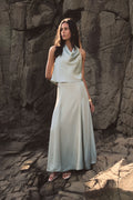 Freya Satin Godet Skirt in pistachio, full-length front view worn with a matching cowl neck top outdoors