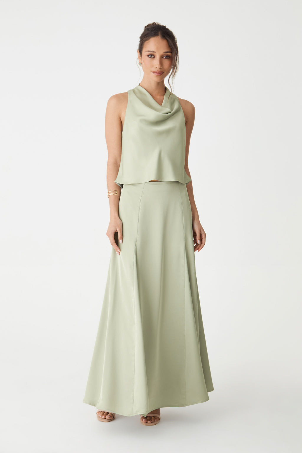 Front view of the pistachio Freya Satin Godet Skirt showing the flared maxi hem, worn with a matching top