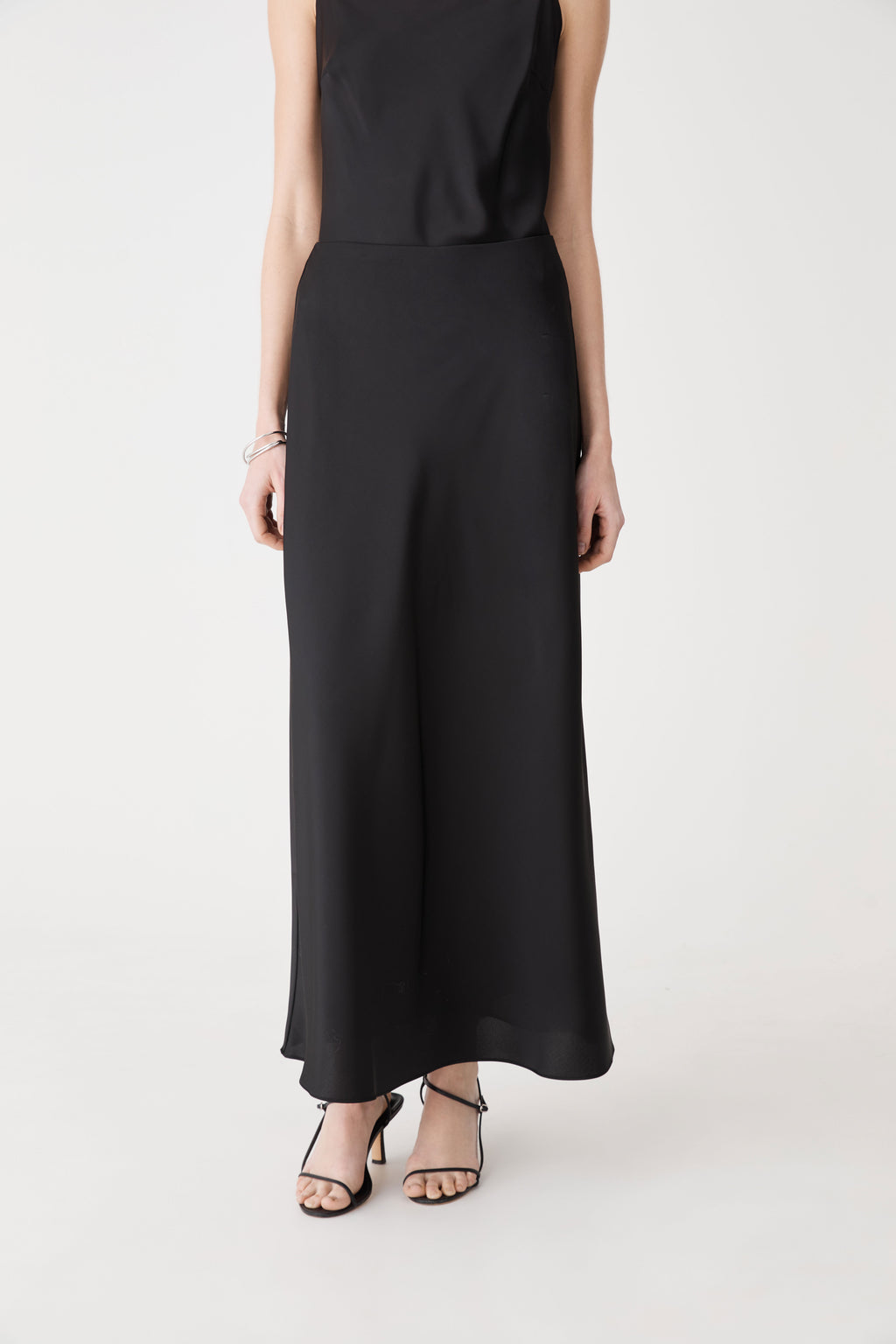 Louise Bias Satin Skirt in black — close-up view