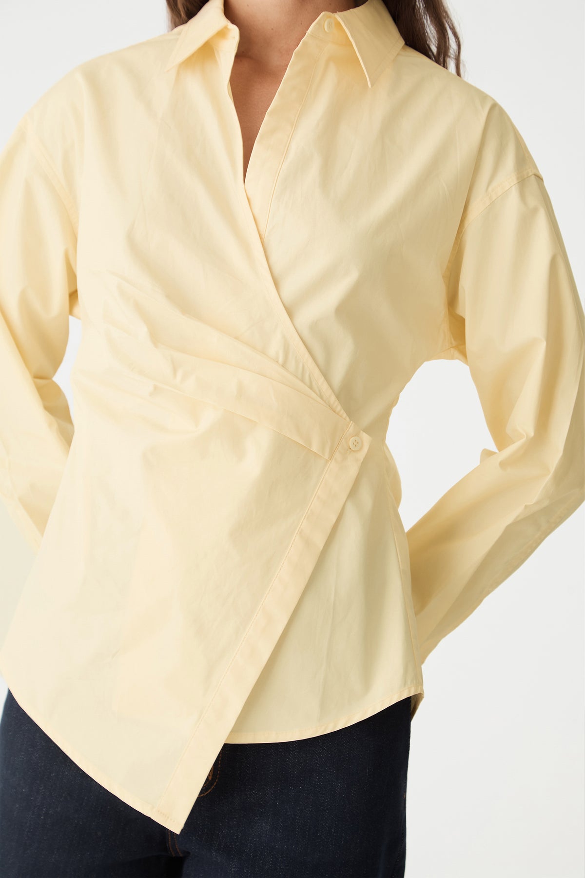 Detail of the wrap front and side-button closure on the Limoncello shirt