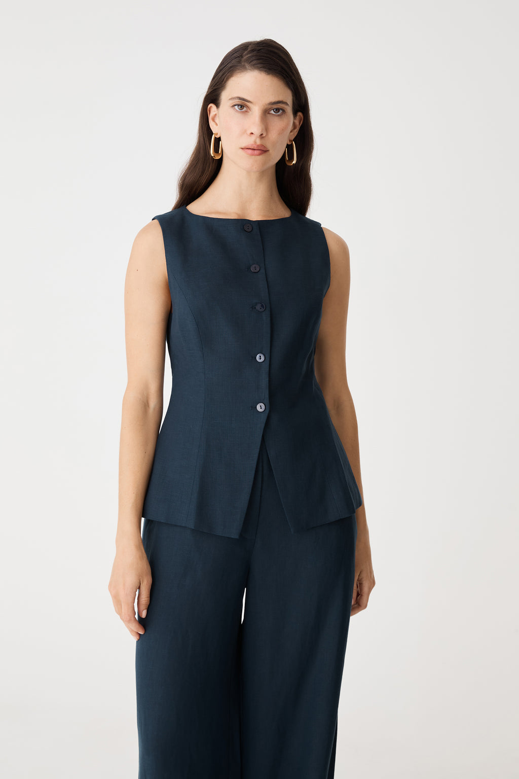 Close-up front view of the navy Phoebe vest top showing round neckline and button front
