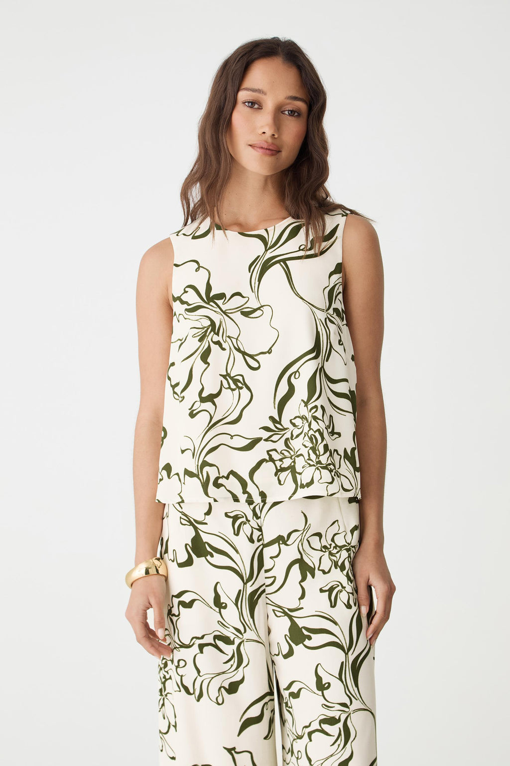 Front close-up of the cream and olive floral print and high round neckline