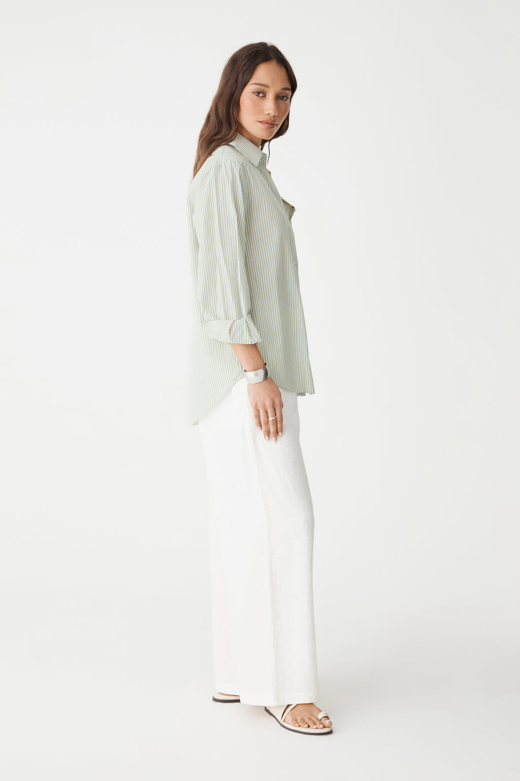 Side view showing dropped shoulders and curved shirttail hem