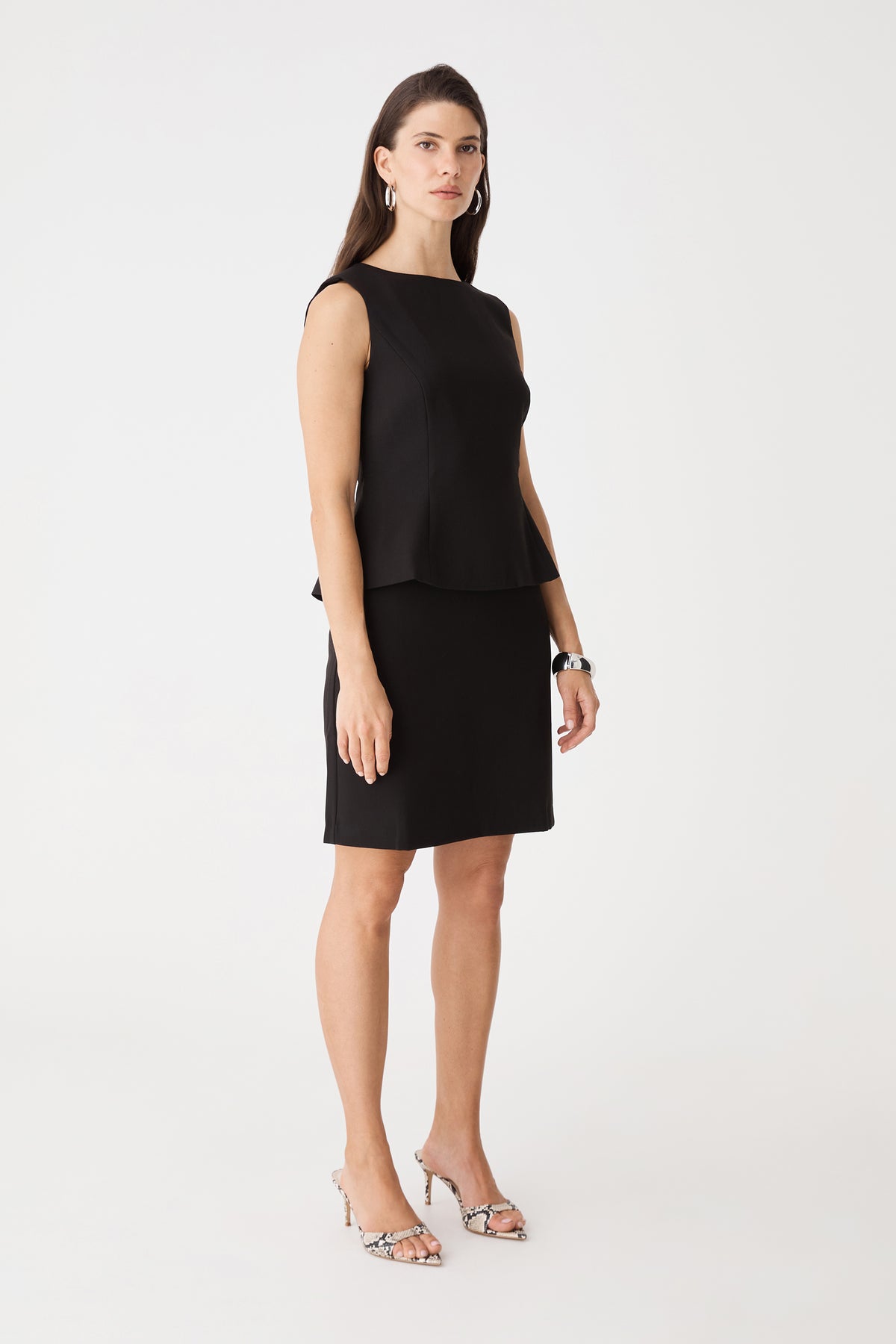 Side view of the black Melanie 2 Tailored Top with matching skirt