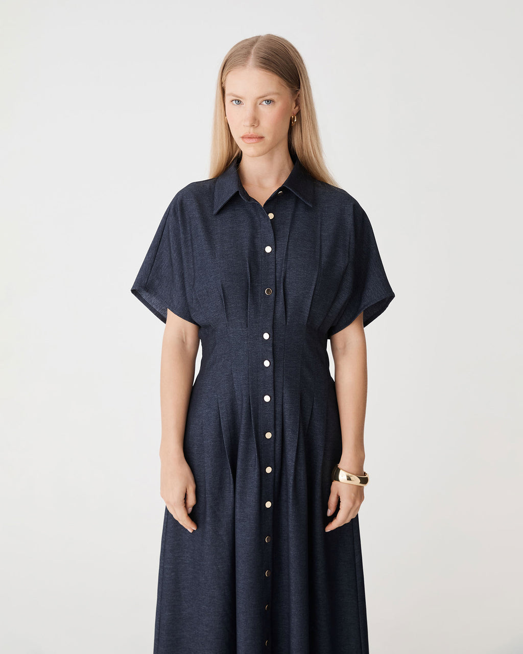 Gilda Pleat Waist Dress in indigo — close-up view