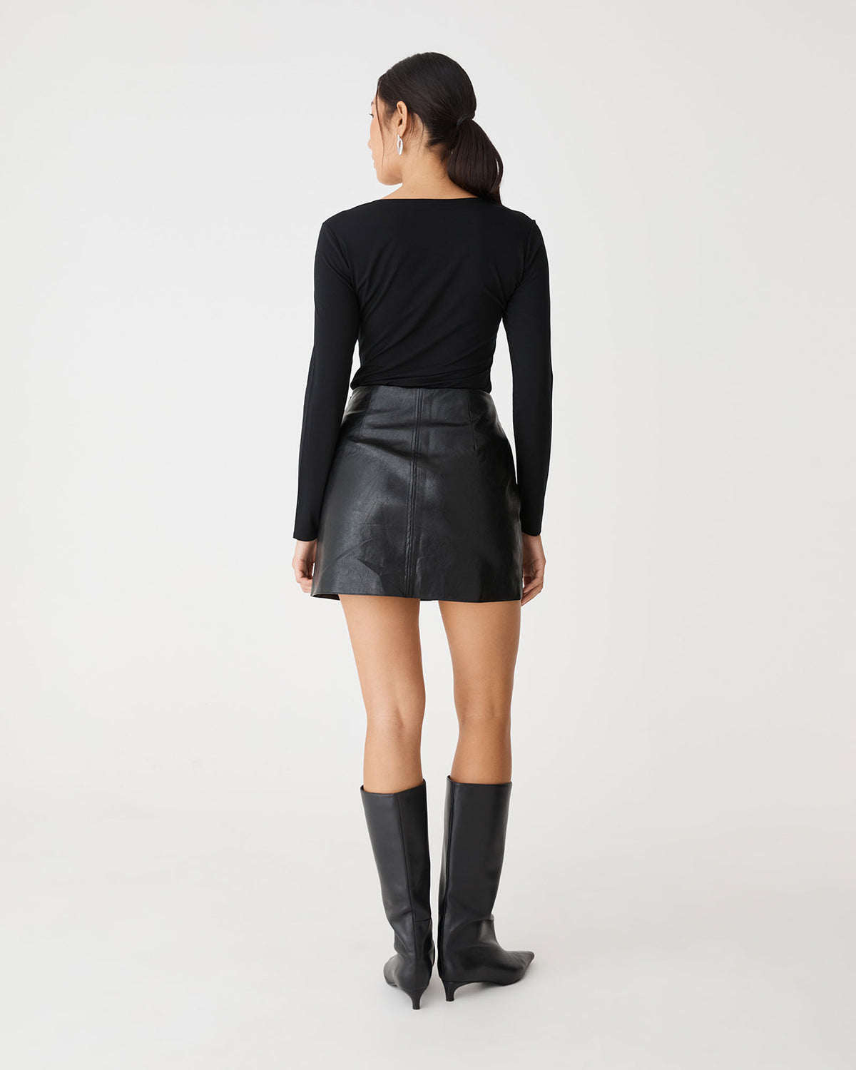 Shay Faux Leather Mini Skirt in black — back view