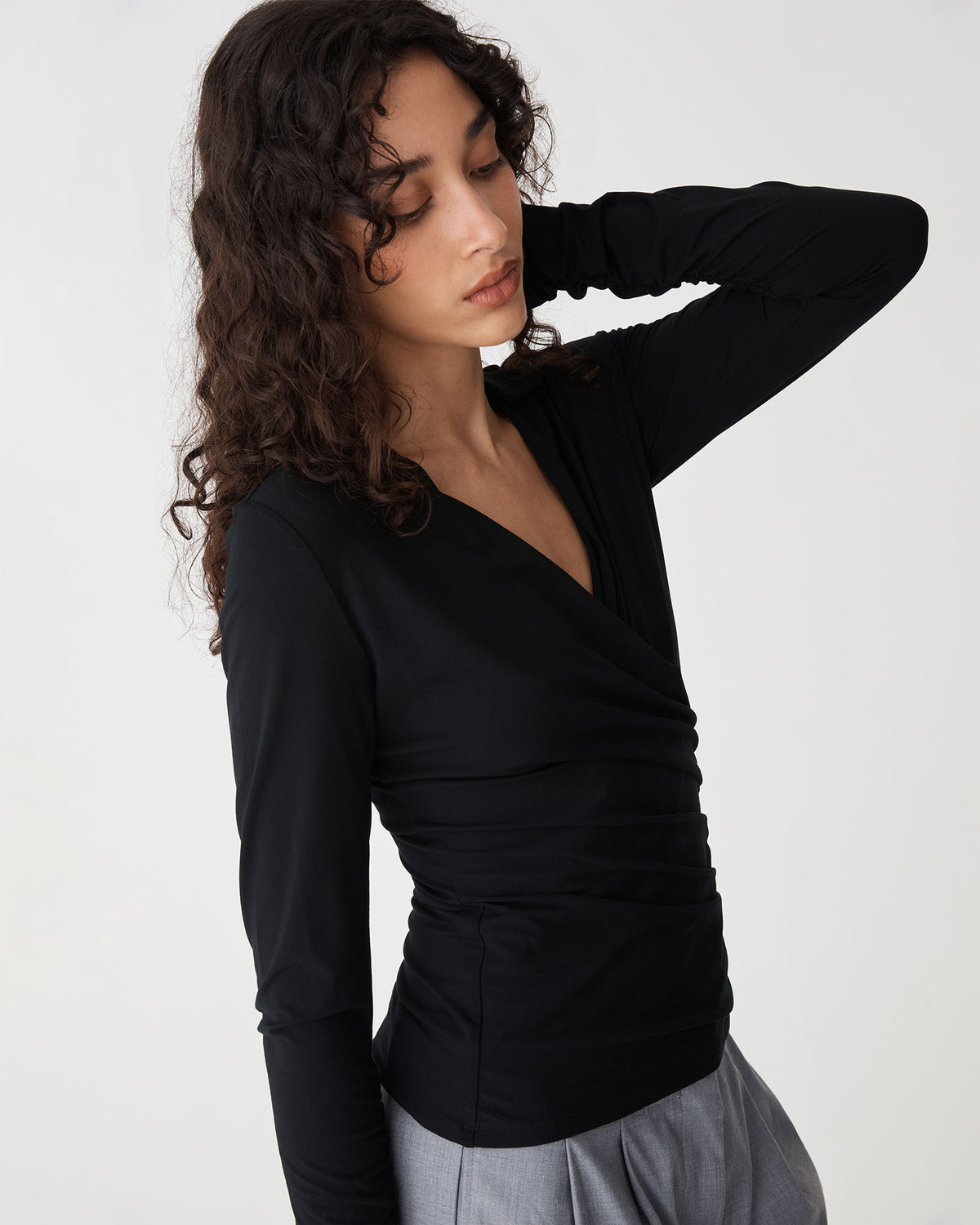 Solene Bamboo Wrap Top in black — side view