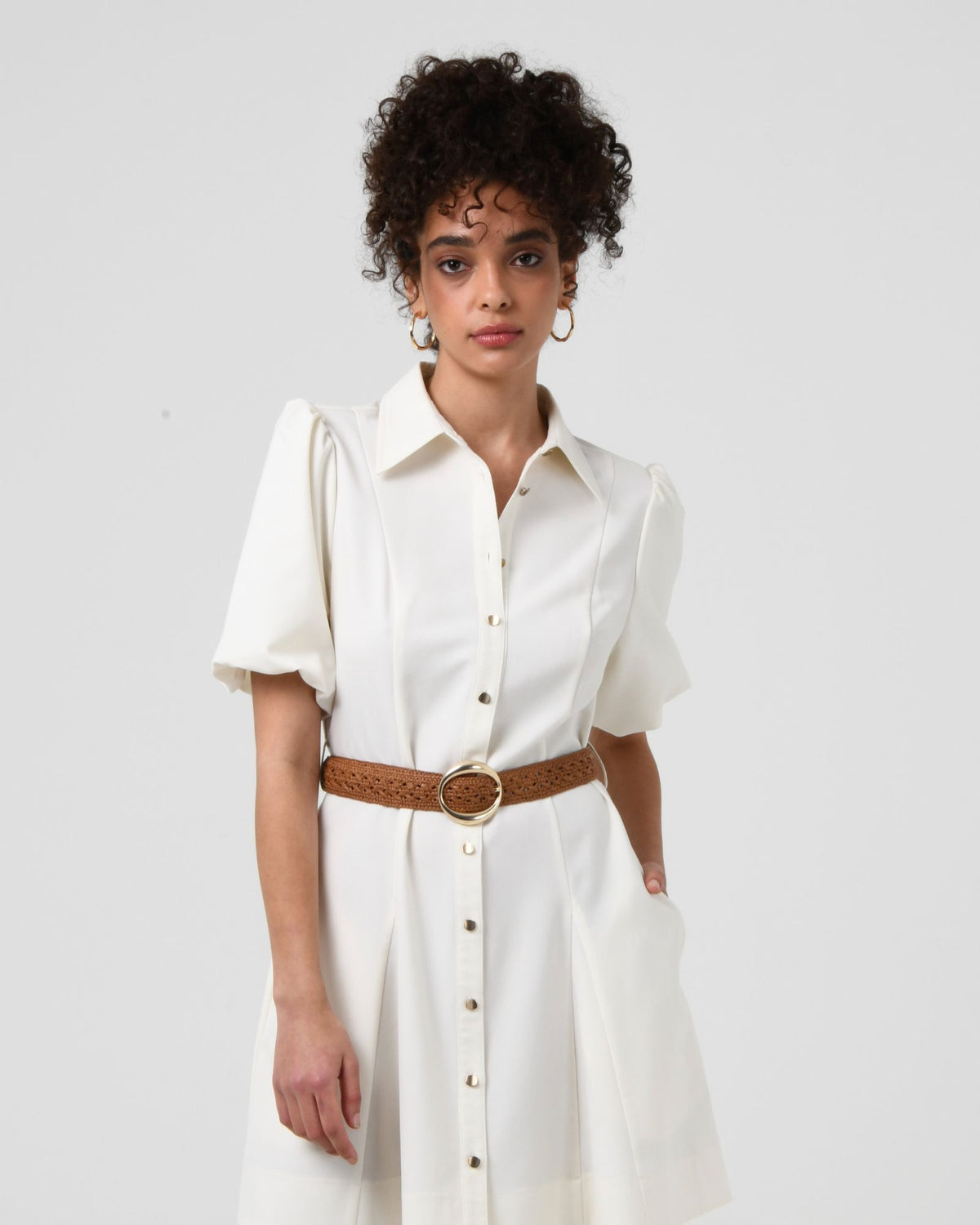 Elena Crochet Belt in tan worn at the waist over a white shirt dress, front view